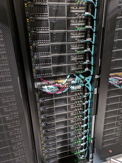 A densely patched rack of servers