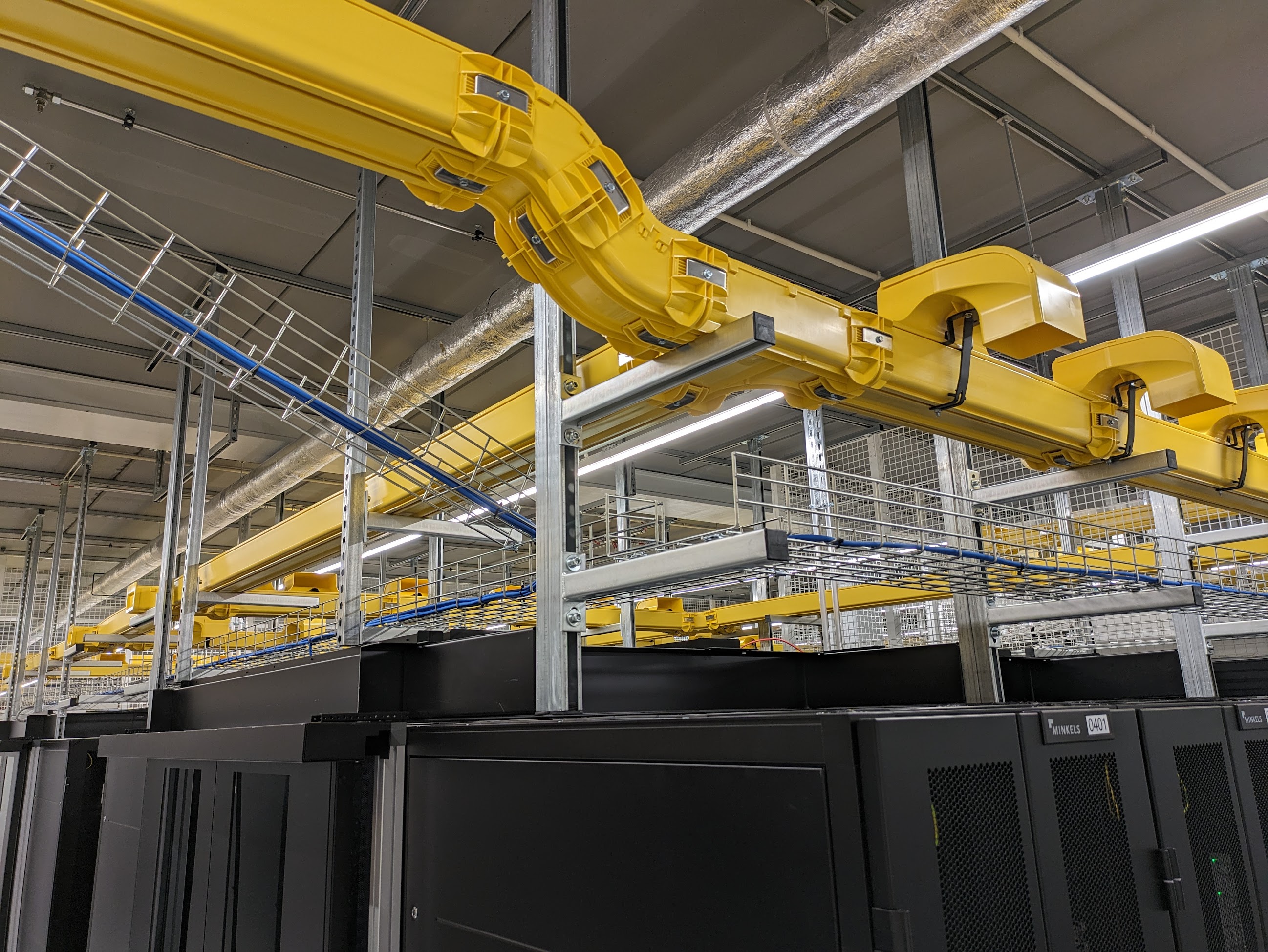 Overhead containment above a row of cabinets