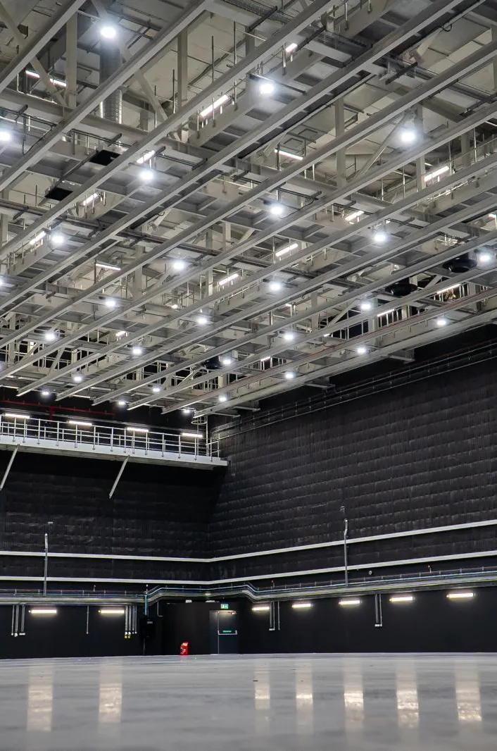 Large empty data hall under a lighting grid