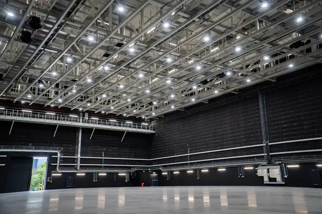 An empty data hall with its lighting grid, before fit-out