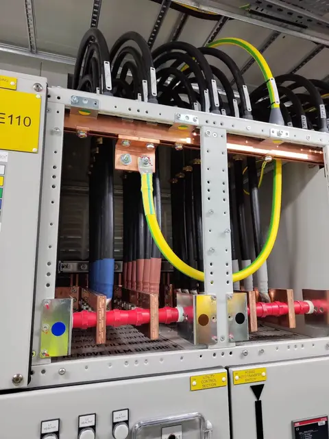 Copper busbar terminations with yellow and green earth cables